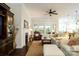 Bright living room featuring a fireplace, large windows, and comfortable seating at 8818 Artesa Mill Ln, Charlotte, NC 28214