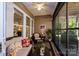 Relaxing screened-in porch with comfortable seating and natural light at 8818 Artesa Mill Ln, Charlotte, NC 28214