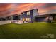 The backyard features a stone patio, outdoor grill, and fire pit, ideal for relaxation and entertaining guests at 1033 Dorsey Dr, Fort Mill, SC 29715