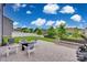 Spacious patio with outdoor seating & grill overlooking a large green backyard, perfect for outdoor entertaining and relaxing at 1033 Dorsey Dr, Fort Mill, SC 29715