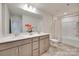 Bathroom featuring double sinks, a large mirror, and a shower-tub combo at 1033 Dorsey Dr, Fort Mill, SC 29715