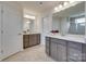 Bathroom boasts double vanities, a large mirror, and modern fixtures at 1033 Dorsey Dr, Fort Mill, SC 29715