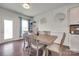 Bright dining room with wood table and chairs, modern decor, and hardwood floors at 1033 Dorsey Dr, Fort Mill, SC 29715
