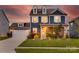 Charming two-story home with a landscaped lawn, dormer windows, and attached garage, perfect for curb appeal at 1033 Dorsey Dr, Fort Mill, SC 29715