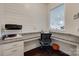Bright home office features a built-in desk with granite countertops and views into the kitchen at 1033 Dorsey Dr, Fort Mill, SC 29715