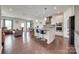 Open-concept kitchen with granite island, stainless steel appliances, and ample seating, ideal for modern living at 1033 Dorsey Dr, Fort Mill, SC 29715