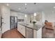 Bright kitchen with stainless steel appliances, large island, and hardwood floors at 1033 Dorsey Dr, Fort Mill, SC 29715