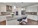 Modern kitchen boasts granite counters, stainless appliances, island with seating, and stylish pendant lighting at 1033 Dorsey Dr, Fort Mill, SC 29715