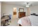 Comfortable main bedroom with an adjacent bathroom and ample space for a desk at 1033 Dorsey Dr, Fort Mill, SC 29715