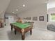Basement billiard room with pool table and adjoining wet bar for entertaining at 104 Golden Bell Ct, Mooresville, NC 28117