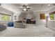 Spacious basement living area with plush carpeting, comfortable seating, and entertainment center at 104 Golden Bell Ct, Mooresville, NC 28117