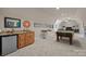 Basement wet bar featuring custom wood cabinets, granite countertops, and beverage fridge at 104 Golden Bell Ct, Mooresville, NC 28117