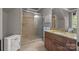 Bathroom featuring a shower, sink, and vanity with granite countertop at 104 Golden Bell Ct, Mooresville, NC 28117
