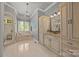Bathroom featuring a soaking tub, walk-in shower, and marble countertops at 104 Golden Bell Ct, Mooresville, NC 28117