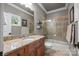 Bathroom featuring a vanity with granite countertop, sink, toilet, and a tiled shower with glass door at 104 Golden Bell Ct, Mooresville, NC 28117