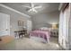 Bedroom with a desk, bed, and ceiling fan at 104 Golden Bell Ct, Mooresville, NC 28117