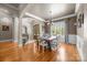 Inviting dining room with hardwood floors, large windows, and stylish lighting fixtures at 104 Golden Bell Ct, Mooresville, NC 28117