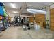 Spacious garage featuring storage shelving and high ceilings at 104 Golden Bell Ct, Mooresville, NC 28117