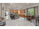 Open kitchen boasts an island with seating, stainless appliances, and adjacent breakfast area at 104 Golden Bell Ct, Mooresville, NC 28117