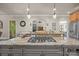 Stunning kitchen island featuring granite countertops and stainless steel gas cooktop at 104 Golden Bell Ct, Mooresville, NC 28117