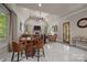Cozy living room with vaulted ceilings, a fireplace, and a barrel table with chairs at 104 Golden Bell Ct, Mooresville, NC 28117