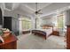Bedroom features vaulted ceilings, large windows, and comfortable furniture at 104 Golden Bell Ct, Mooresville, NC 28117
