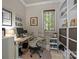 Bright office space with a large window, built-in shelving, and comfortable chair at 104 Golden Bell Ct, Mooresville, NC 28117