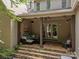 Covered outdoor patio with comfortable seating and string lights for evening enjoyment at 104 Golden Bell Ct, Mooresville, NC 28117