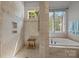 Shower with tiled walls and floors, a wooden bench, and glass shower door at 104 Golden Bell Ct, Mooresville, NC 28117