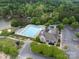 Beautiful aerial view showcases the pool, clubhouse, and surrounding green spaces at 1096 Palmyra Dr, Tega Cay, SC 29708