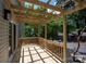 Newly built deck with wooden railings and partial pergola cover providing a perfect spot for outdoor relaxation at 1096 Palmyra Dr, Tega Cay, SC 29708