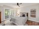 A bedroom features backyard access, warm lamps, neutral paint, an area rug, and soft decor at 1096 Palmyra Dr, Tega Cay, SC 29708
