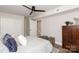 Cozy bedroom with hardwood floors, closet, and stairs to another level creating a warm and inviting atmosphere at 1096 Palmyra Dr, Tega Cay, SC 29708
