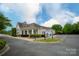 Beautiful community clubhouse featuring manicured landscaping and ample parking at 1096 Palmyra Dr, Tega Cay, SC 29708