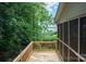 A wooden deck runs alongside the home with wood railings, offering lovely views at 1096 Palmyra Dr, Tega Cay, SC 29708