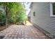 A brick patio runs alongside the home, providing backyard access at 1096 Palmyra Dr, Tega Cay, SC 29708