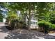 Charming home surrounded by lush greenery and mature trees, offering a serene and private setting at 1096 Palmyra Dr, Tega Cay, SC 29708