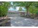 The charming exterior showcasing a well-manicured lawn, a long drive, and a beautifully designed facade with stone accents at 1096 Palmyra Dr, Tega Cay, SC 29708