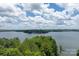 A beautiful lake view with trees in the foreground and scenic sky at 1096 Palmyra Dr, Tega Cay, SC 29708
