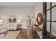Inviting living room with hardwood floors, neutral color scheme, and stylish decor, with a staircase visible in the background at 1096 Palmyra Dr, Tega Cay, SC 29708