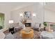 A spacious living room features neutral paint, a stone fireplace, recessed lighting, and stylish decor at 1096 Palmyra Dr, Tega Cay, SC 29708