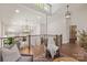 A stylish living room features neutral paint, recessed lighting, and contemporary chandeliers at 1096 Palmyra Dr, Tega Cay, SC 29708