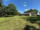 Expansive backyard with lush greenery and mature trees, offering ample space for outdoor activities at 116 Lanes End Rd, Locust, NC 28097