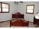 Bedroom showcasing a wooden bed frame with dark wood trim at 116 Lanes End Rd, Locust, NC 28097