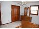Bedroom features a full dresser with mirror and closet at 116 Lanes End Rd, Locust, NC 28097