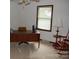 Bedroom featuring a desk, rolling chair, lamp, and rocking chair at 116 Lanes End Rd, Locust, NC 28097