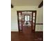 Elegant dining room with hardwood floors, beamed ceilings, and a chandelier at 116 Lanes End Rd, Locust, NC 28097