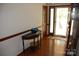 Inviting foyer with hardwood floors, a half-round table, and a view of the front door at 116 Lanes End Rd, Locust, NC 28097