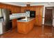Kitchen featuring an island, lots of cabinet space, and stainless steel appliances at 116 Lanes End Rd, Locust, NC 28097