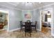 Eat-in kitchen features a dark wood dining table, chairs, and an American flag at 118 Sunset Dr, Clover, SC 29710
